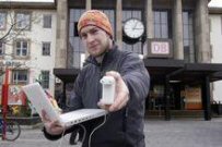 Jan Michael Ihl with his laptop at the train station